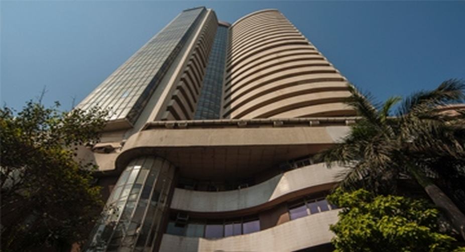 Sensex, Nifty trade flat in morning trade; metal stocks jump