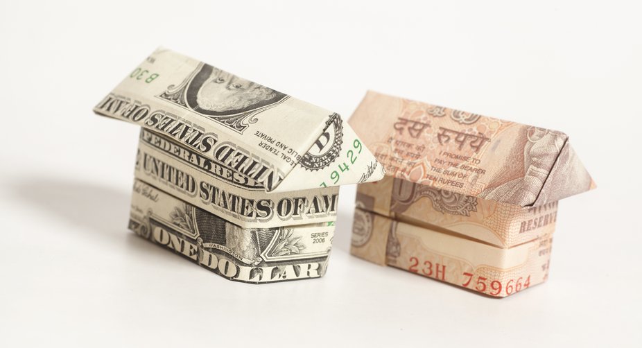 Rupee crosses 67-mark, slumps 52 paise against US Dollar