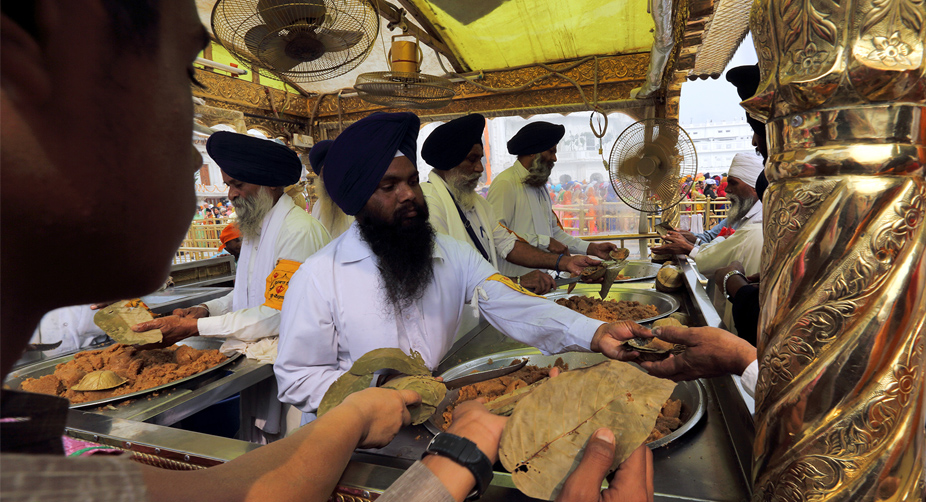 Yummy <i>Parshad </i>is one of the many highlights at the Golden Temple! (Photo: Varun Joshi/SNS) img