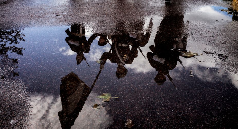 French soldiers taking part in a military parade are reflected in pools of rainwater in a street of Lyon, central eastern France, during the Armistice Day ceremony marking the 98th anniversary of the end of World War I (Photo: Jeff Pachoud/AFP) img