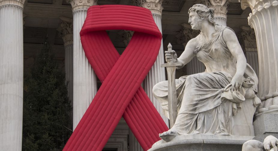 A view of Austrian Parliament decorated with large HIV (AIDS) awarnes ribbon is pictured on the eve of the World AIDS Day in Vienna, Austria (Photo: Joe Klamar/AFP) img