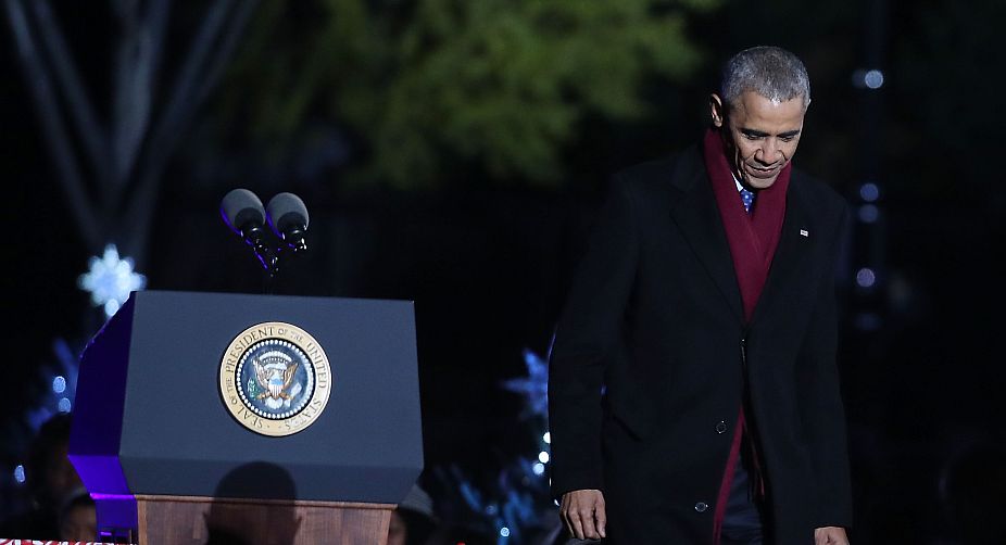 President Obama getting down the stage after the speech (Photo: AFP) img