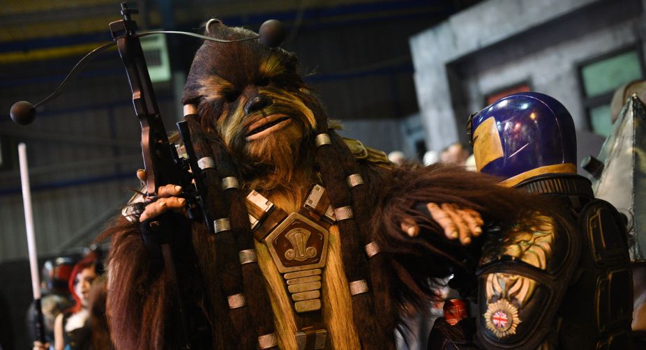The independent fan convention features actors, merchandise and live music alongside numerous recreated props and sets from science fiction films such as: Transformers, Judge Dredd, Jurassic Park, ET and Star Wars (Photo: Oli Scarff/AFP) img
