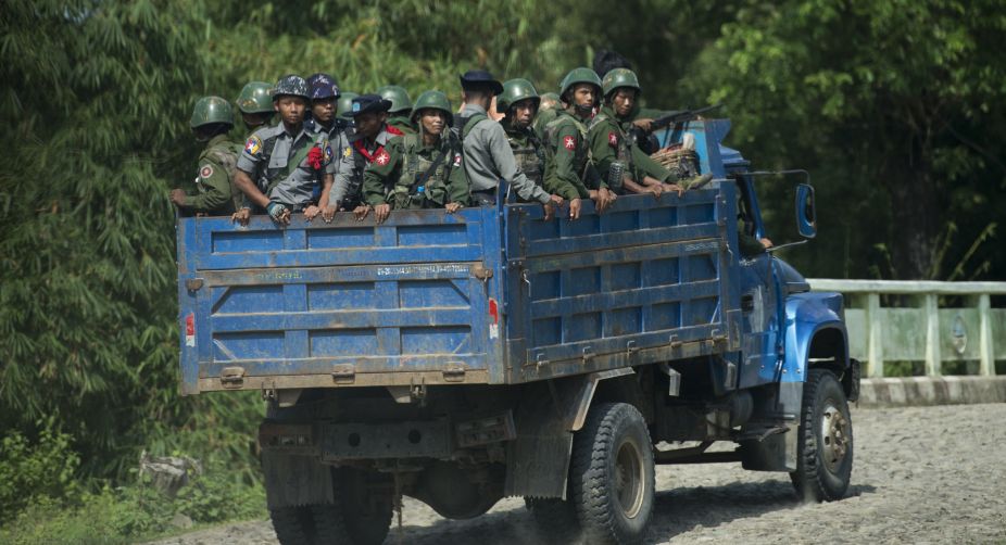 Thousands flee Myanmar border town after rebel raid