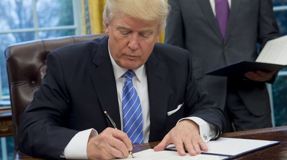 Trump signs executive order withdrawing US from TPP