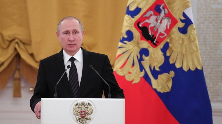Vladimir Putin urges citizens to vote in presidential election