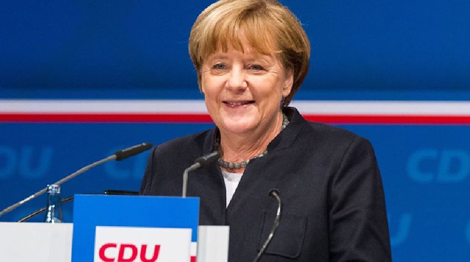 Merkel defends refugee policy, says Islam belongs to Germany