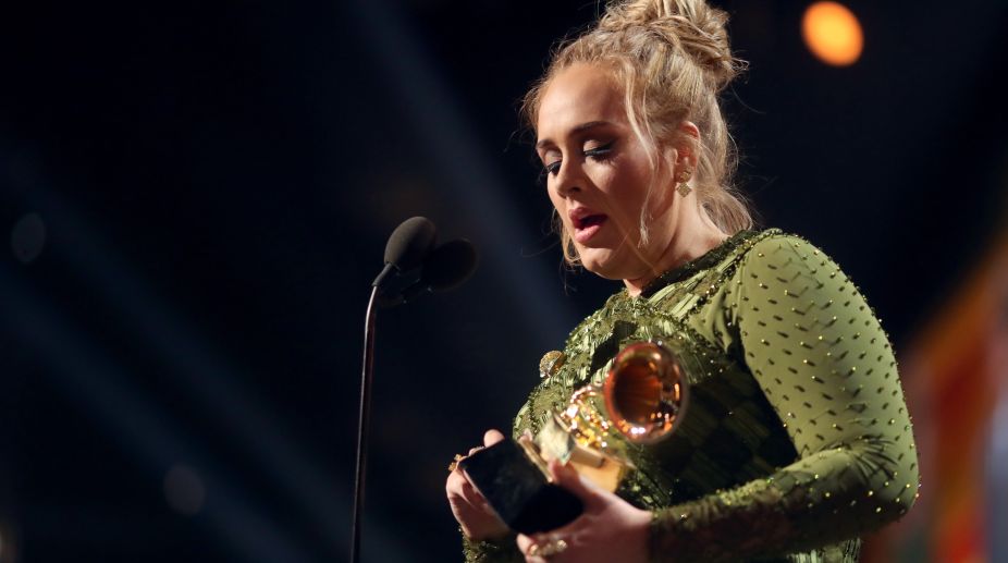 Adele broke her Album of the Year Grammy in two