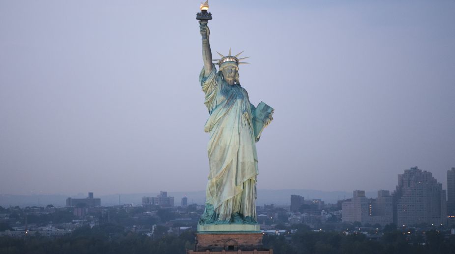 Banner ‘Refugees Welcome’ unfurled at Statue of Liberty