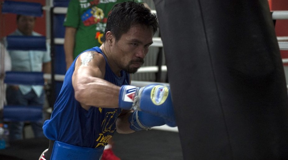 Manny Pacquiao to fight Britain’s Amir Khan in April