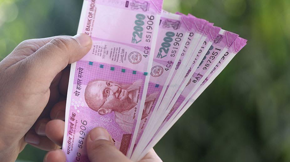 Rupee takes 21-paise hit after Dollar clout grows