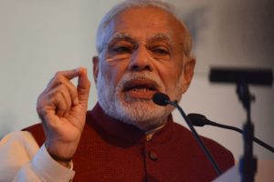 Prime Minister Narendra Modi greets people on Holi
