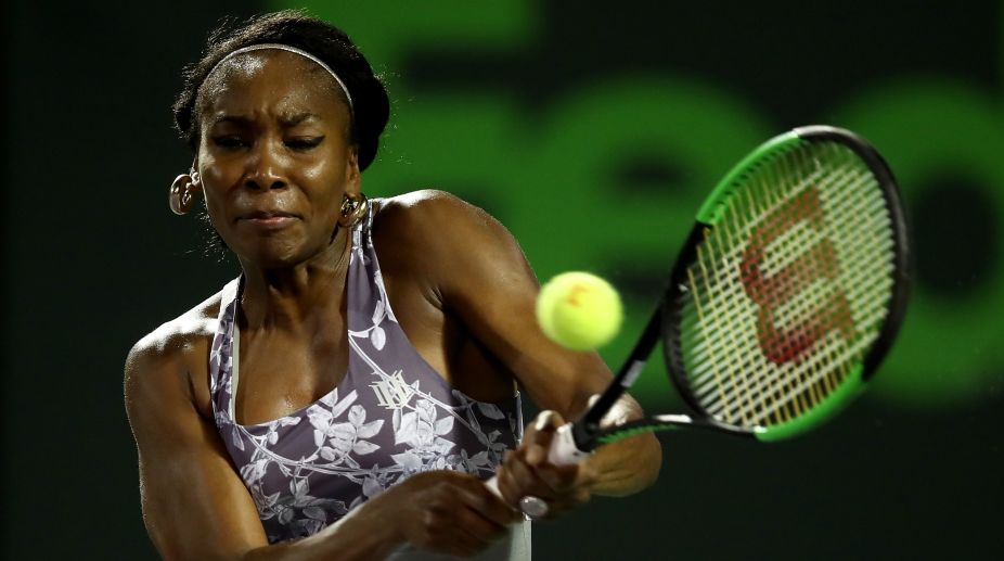 Venus, Kerber advance to third round at windy Miami Open
