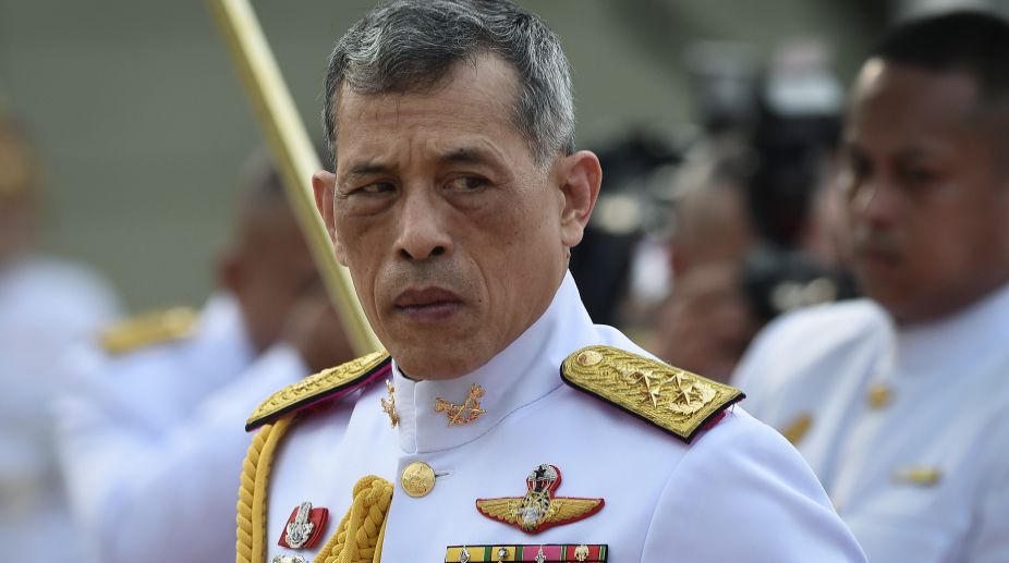 Thai King signs new constitution, paves way for elections