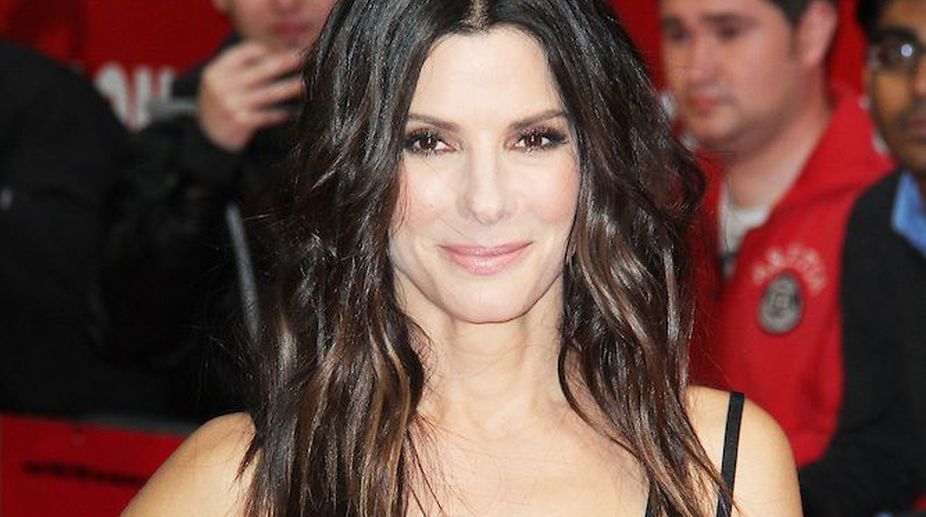 Sandra Bullock spotted with beau during family vacation