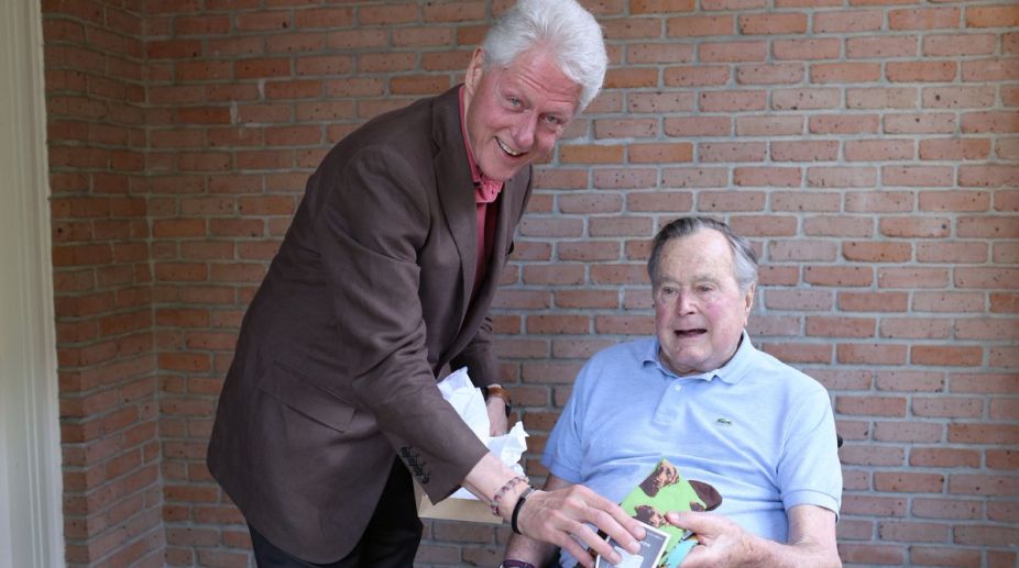 Bill Clinton meets George H W Bush, gifts socks