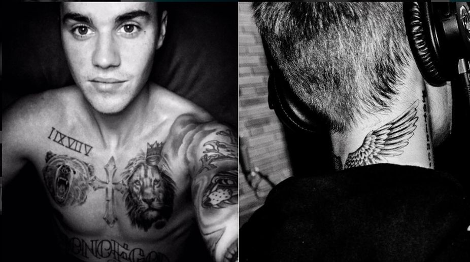 Bieber flaunts tattoos in topless selfie
