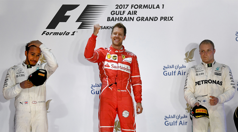 F1: Sebastian Vettel triumphs in Bahrain as Lewis Hamilton pays penalty