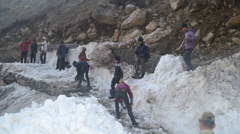 NIM staffs clearing snow in Kedarnath trek route
