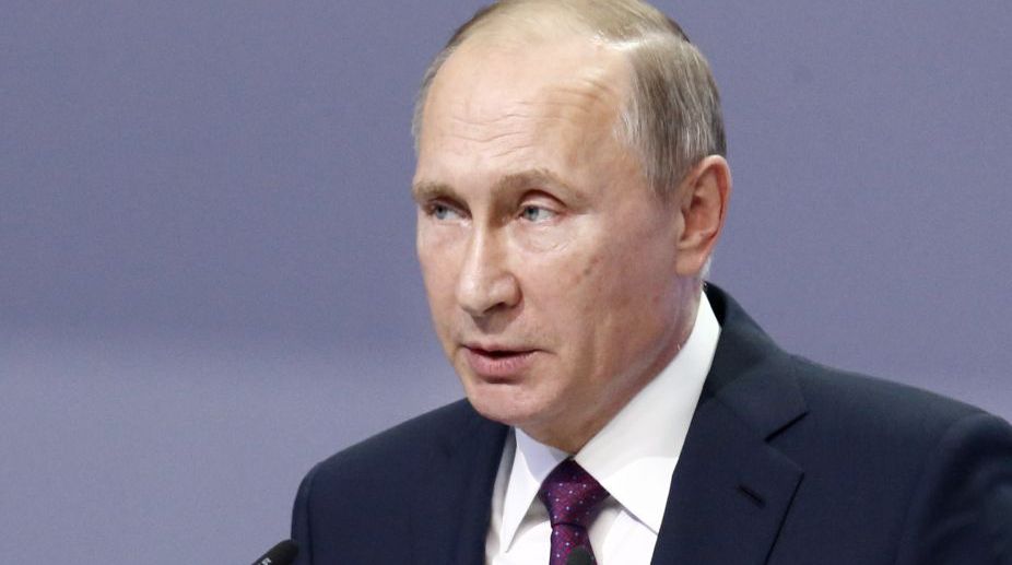Russian President Putin seeks end of mutual mistrust after Macron win