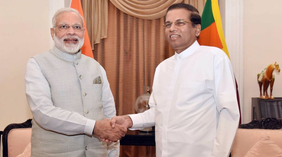 Modi arrives in Sri Lanka, meets President