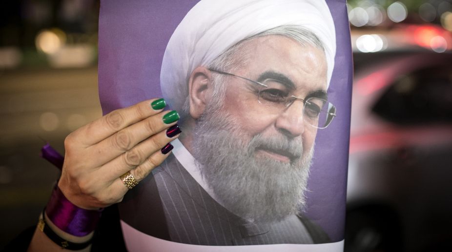 Hassan Rouhani looks to beat hard-liner as Iran prepares to vote