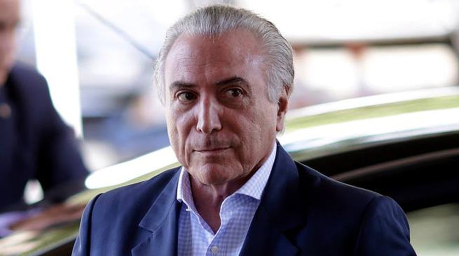 Temer advisor hands over cash-filled briefcase to police
