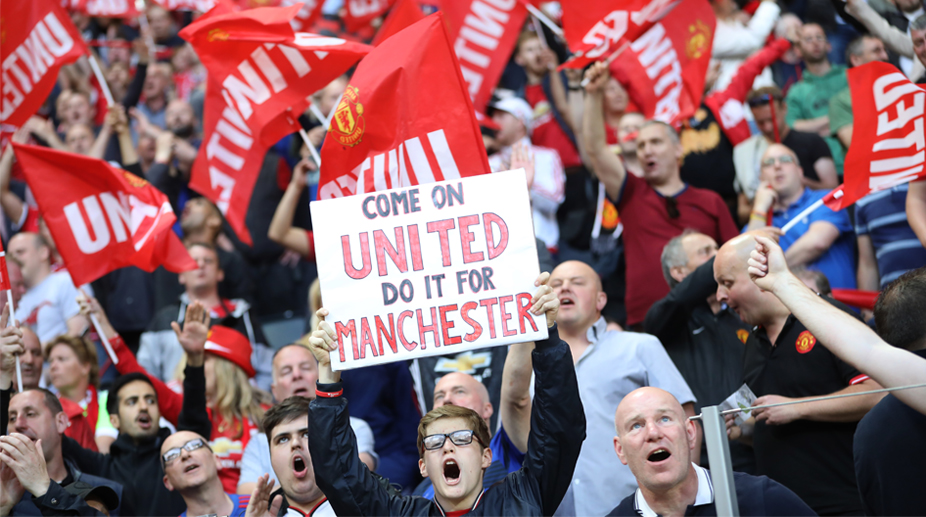 Manchester United fans celebrate Europa League triumph after tragedy