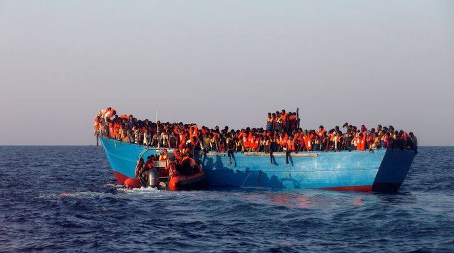 300 rescued migrants land in Italian island