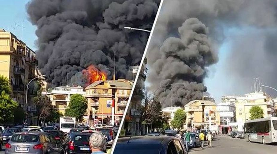 Black smoke billows over Vatican walls