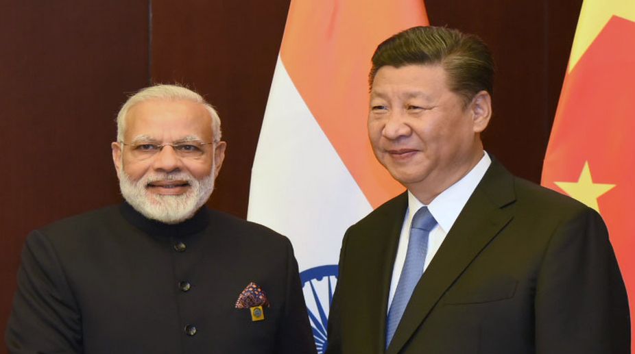 Let’s address sensitive issues: Xi to Modi