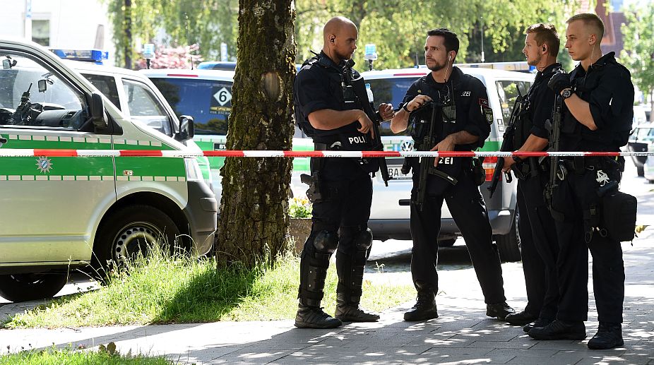 Munich shooting: Attacker shoots lady cop with her own gun
