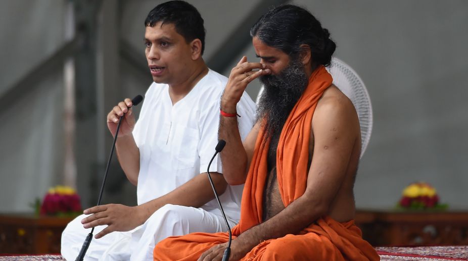 Ramdev guides through massive yoga event in Ahmedabad
