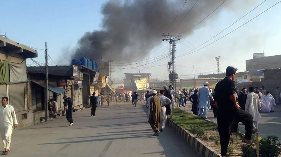Afghan official: 2 people killed by roadside bombs
