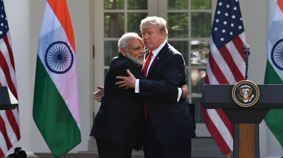With hugs and praise, Modi and Trump strike rapport
