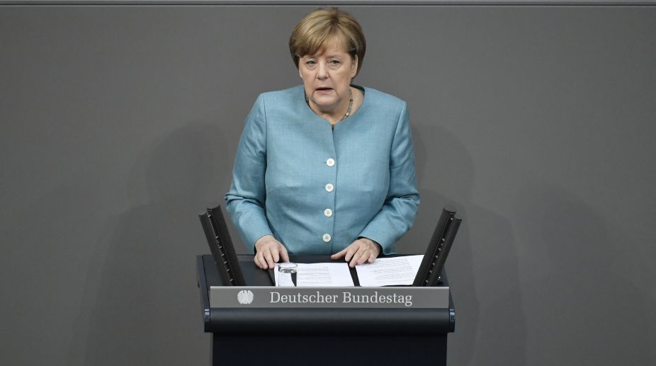 Paris accord irreversible, not negotiable, says Merkel before G20