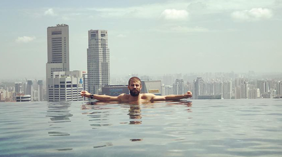 Barcelona defender Gerard Pique relaxing on his Singaporean holiday