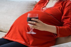How does prenatal alcohol exposure raise addiction risk