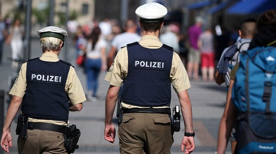 German school evacuated after gunmen seen in ground