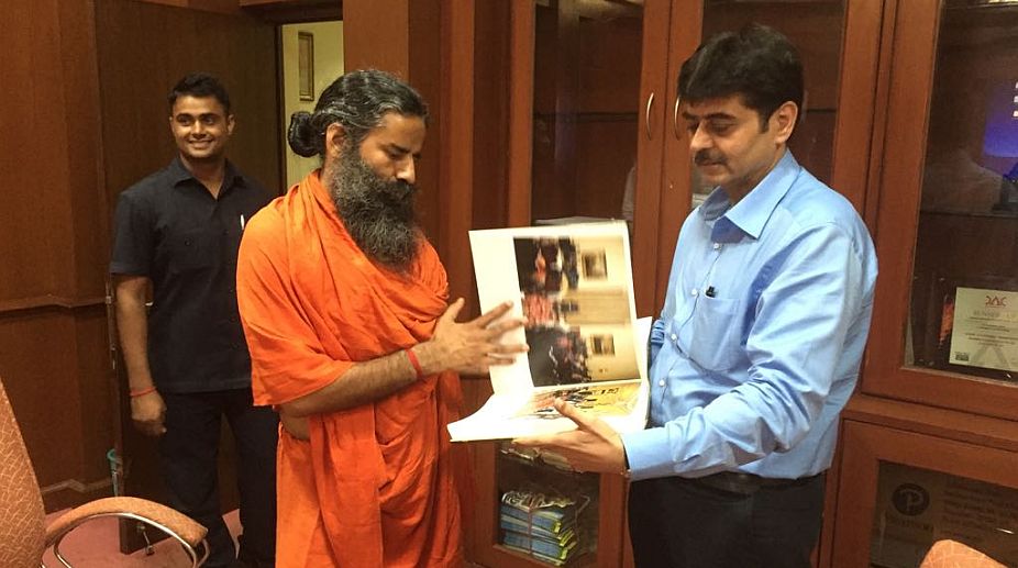 Pictorial book on Pranab Mukherjee’s presidency overwhelms Baba Ramdev