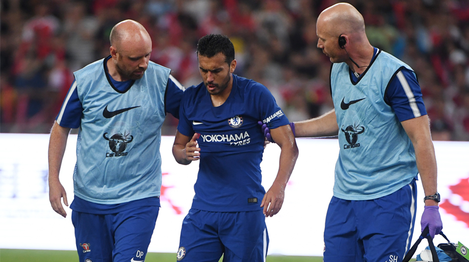 Chelsea winger Pedro returns to London after suffering concussion