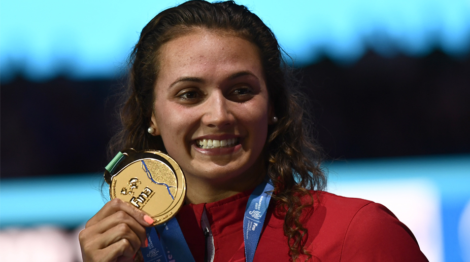Kylie Masse wins 100m backstroke world gold in record time