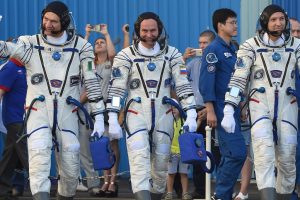 Three-man crew reaches International Space Station