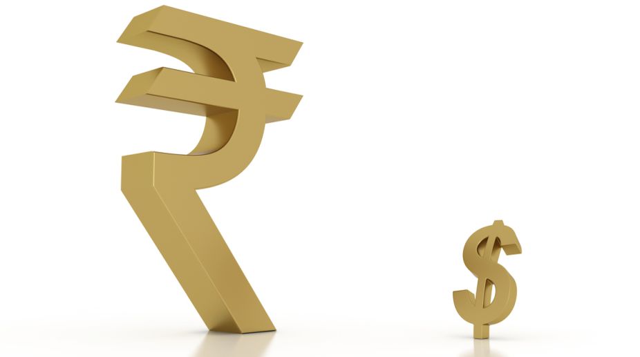 Rupee moves up 10 paise against dollar