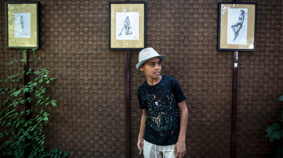 Afghan boy known as ‘Little Picasso’ shows works in Serbia