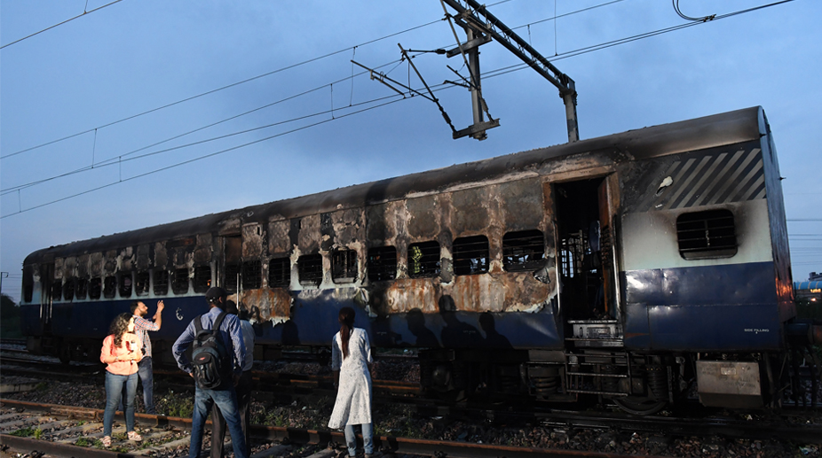 Gujarat HC commutes death sentences of 11 in Godhra train burning