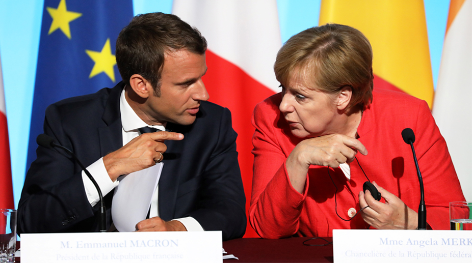 Merkel backs Macron’s labour reform in France