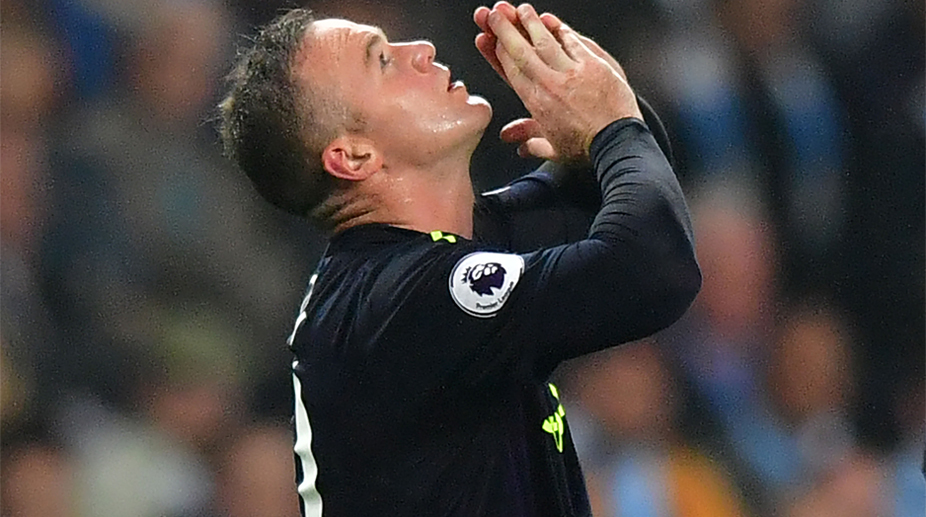 Premier League: Wayne Rooney hits double ton as Everton hold Manchester City