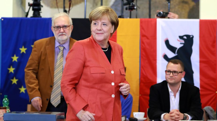 Merkel vows to win back right-wing voters
