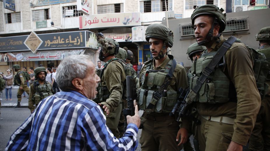 Palestinian gunman kills three Israelis at settlement: police